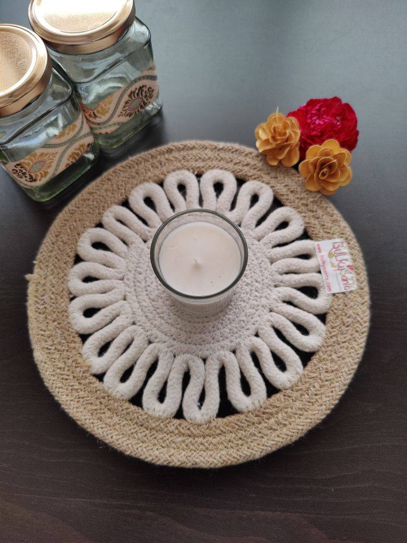 Handcrafted cotton mat shown on a modern white table with accent lighting,
ideal for handcrafted cotton table round placemats.
