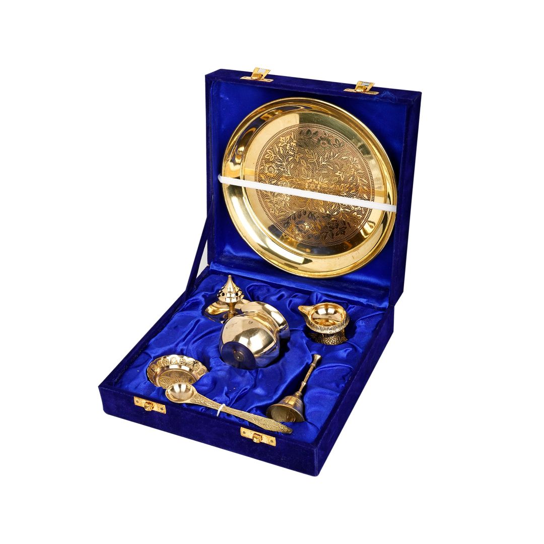 Brass pooja thali 7 inch set displayed in a blue velvet gift box with diya, bowls and spoon, a pure brass pooja thali ideal for daily puja.