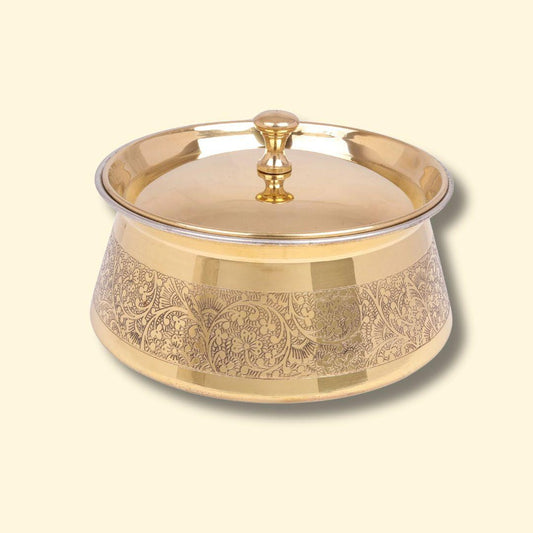 Brass Etching Design Brass Handi, Degchi, Patila (Pital ki handi, Pital ka Patila, Pital ke bartan) featuring an intricate floral etching design around the exterior circumference. The serving pot has a smooth, reflective surface and a matching brass lid with a decorative knob.