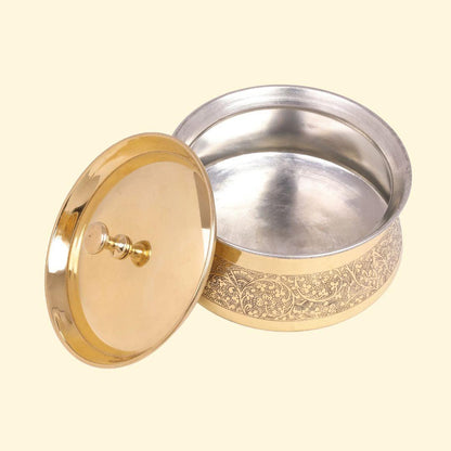 Brass handi for biryani with etched design used for traditional Indian serving