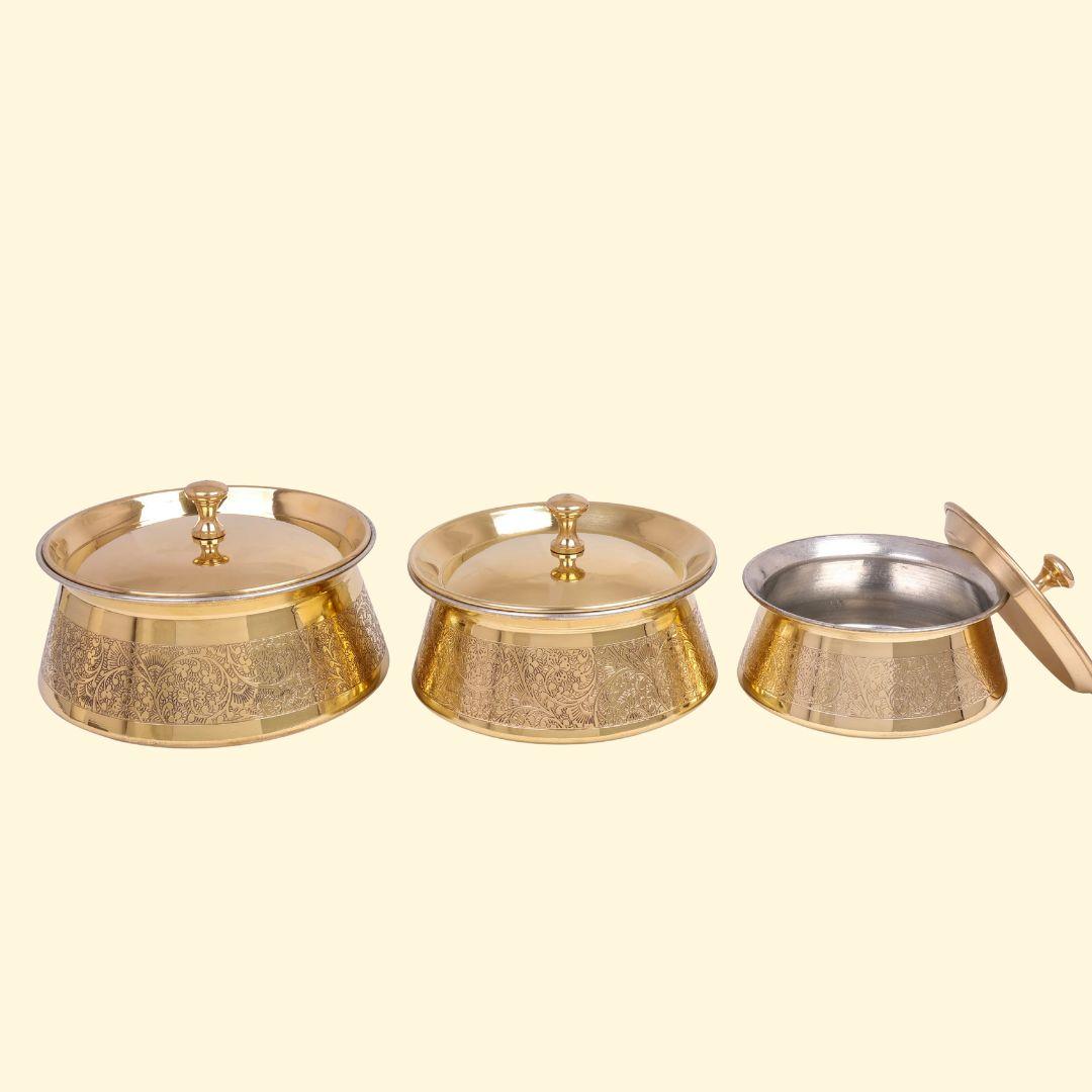 Tin-coated brass handi with lid showing polished golden exterior and etching