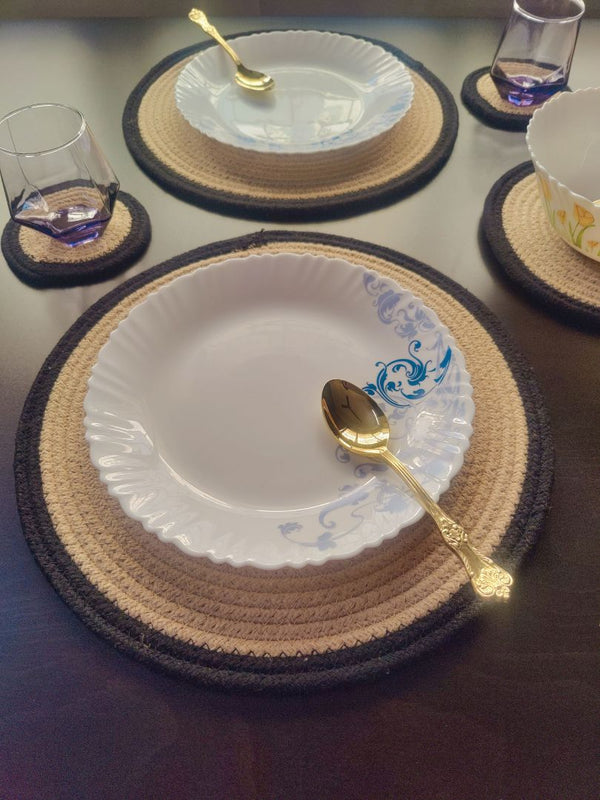 Round braided mat displayed under ceramic plates in a dining setup, ideal for
round dining table placemats. Eco-Friendly & Washable: Made from biodegradable material, these cotton placemats for dining table set of 6 are safe for the environment and easy to clean—ideal for long-term, conscious living.