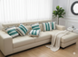 Set of striped premium cotton cushion covers arranged on a beige sofa.