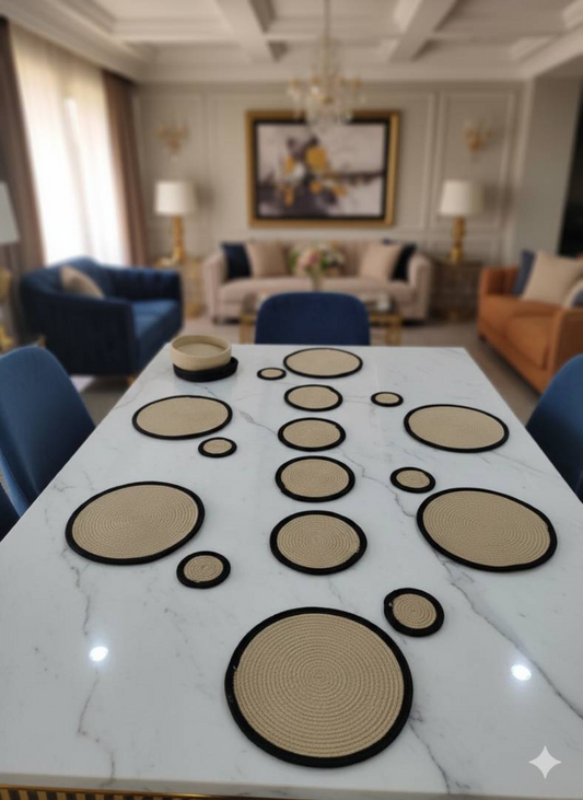 Beige circular mats arranged on a white dining table in a modern living room,
neatly set to showcase place mats for dining table.