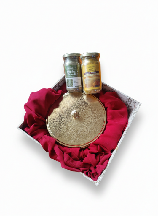 Top-view brass masala box paired with two spice jars set neatly inside the Spice & Herb Fusion Hamper gift box​.