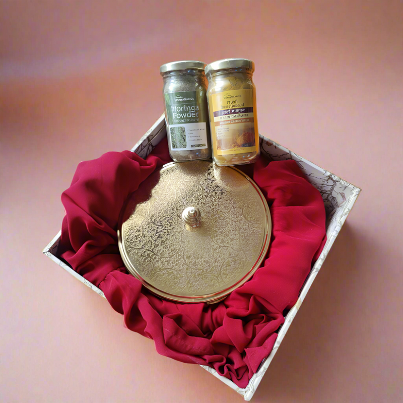 Spice and Herb Fusion Hamper with a brass masala box and two spice jars arranged in a red-lined gift box for thoughtful spice & herb gifting.