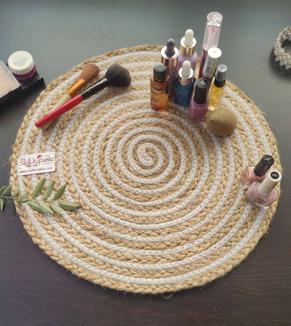 Round spiral mat placed under a white ceramic plate on a dining table, fitting
round cotton placemats.