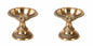 Two brass candle holders on a white background