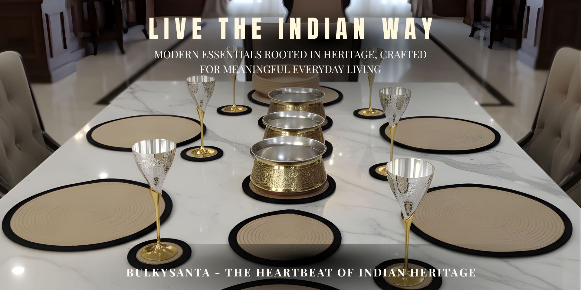 Luxury Indian dining table setup featuring handcrafted brass bowls, gold-stemmed silver goblets, and beige placemats.