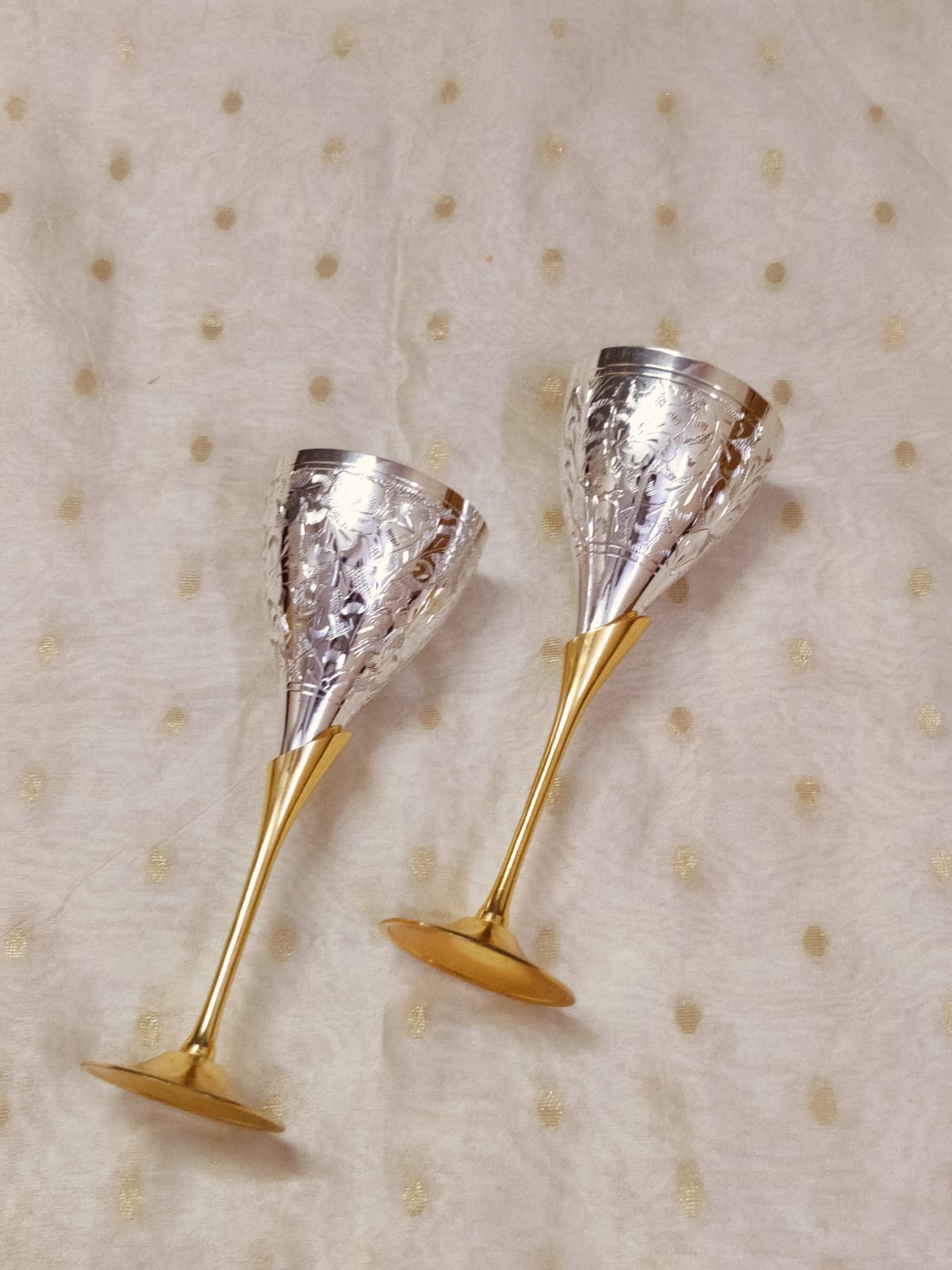 Premium brass champagne flutes with silver engraved body, ideal for elegant gifting.
