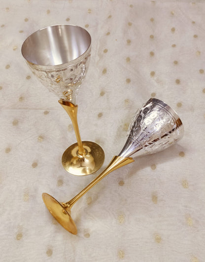 Traditional metal wine glasses in silver and brass, handcrafted engraved design.