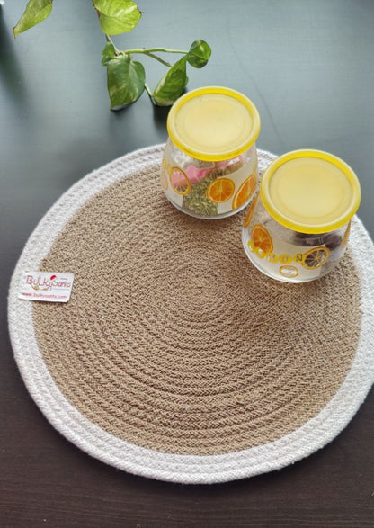 Woven round mat displayed with two yellow drinks on top, creating a bright
tabletop scene suited for round placemats.