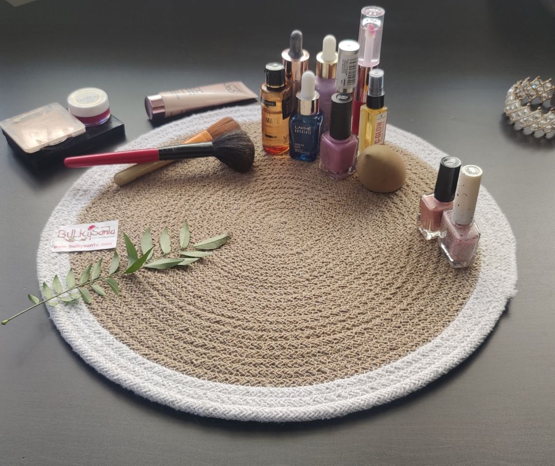 Natural woven round mat styled with beverages and décor items, offering a warm table setup ideal for washable round placemats. Lasting Beauty & Protection: These round mats for table not only protect your surfaces from heat and spills but also add texture and charm to any setup—be it a table matt, place mats, or dining table mats 4 pieces configuration.