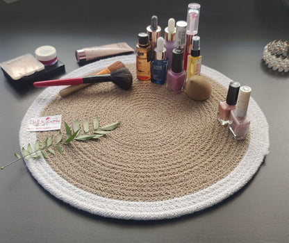 Natural woven round mat styled with beverages and décor items, offering a warm table setup ideal for washable round placemats. Lasting Beauty & Protection: These round mats for table not only protect your surfaces from heat and spills but also add texture and charm to any setup—be it a table matt, place mats, or dining table mats 4 pieces configuration.