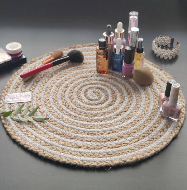 Handwoven jute spiral round mat styled on a book and table setup, ideal as rustic
round table mats.