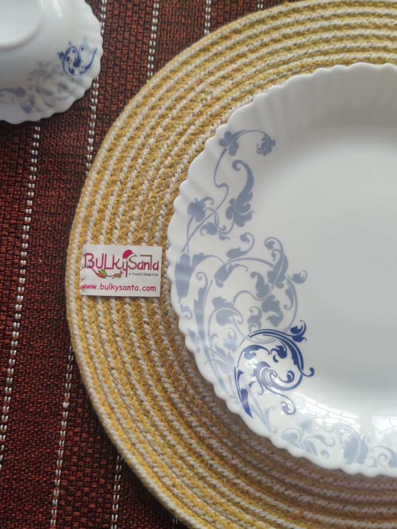 Yellow cotton mat featured in a festive setup with candles and ornaments, ideal
for washable round placemats.