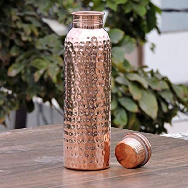 Copper bottle online photographed with cap removed, highlighting authentic build for customers planning to buy copper water bottle online.