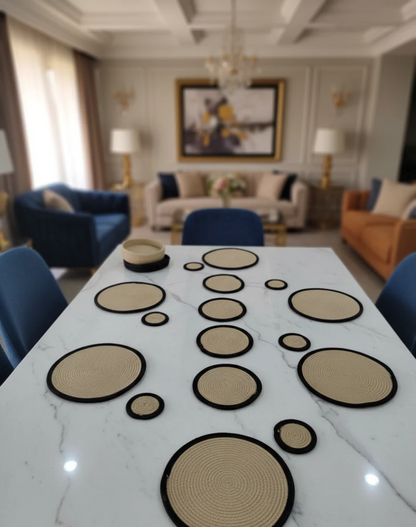Large dining table arranged with full set of round cotton table mats, coasters and
trivets for 6 to 8 seater dining setups.