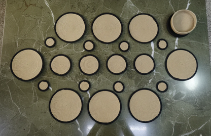 Coordinated round cotton table mats, coasters and hot pads displayed on dining
table for eco-friendly table organization.
